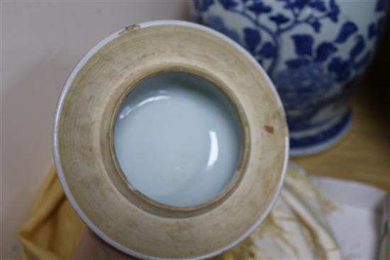 A Chinese blue and white painted lidded baluster vase, painted with blossoming peonies height 45cm, cracked